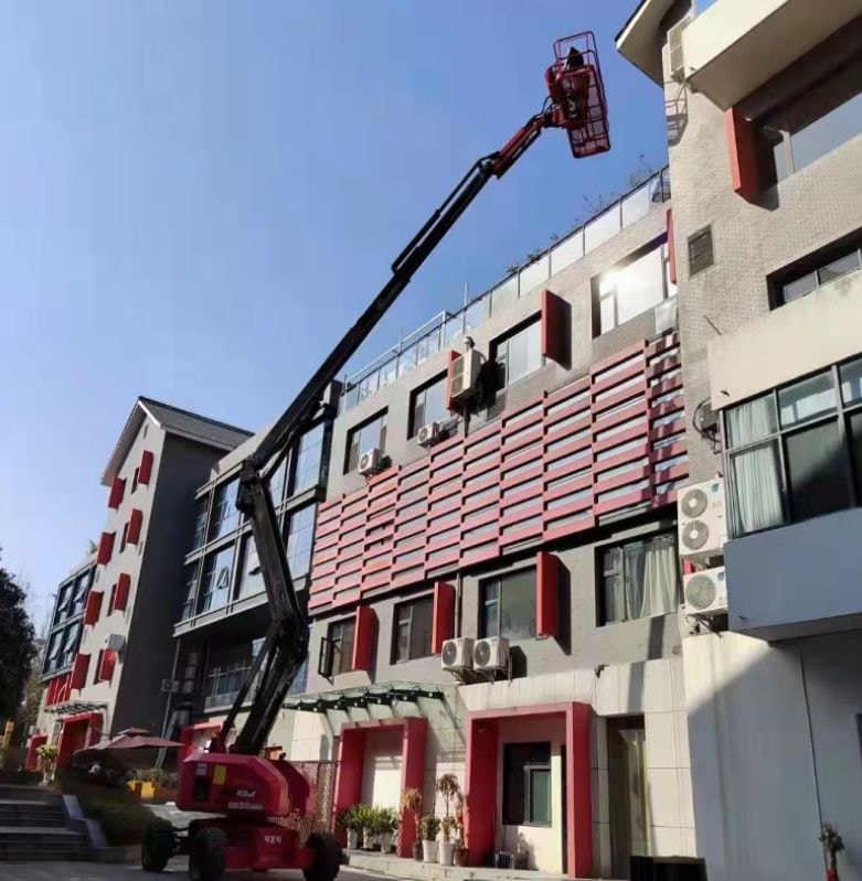 Xe nâng người boom lift khớp gập 